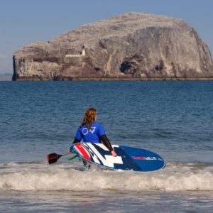 SUP paddle boarding with Starboard on Seacliff Beach in East Lothian with the Bass Rock in the background