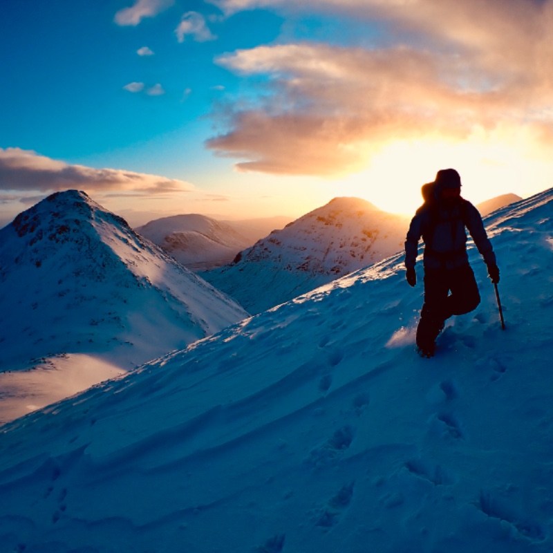 Winter mountaineering at sunrise in Glen Coe looking towards Buachaille Etive Mor from Buachaille Etive Beag