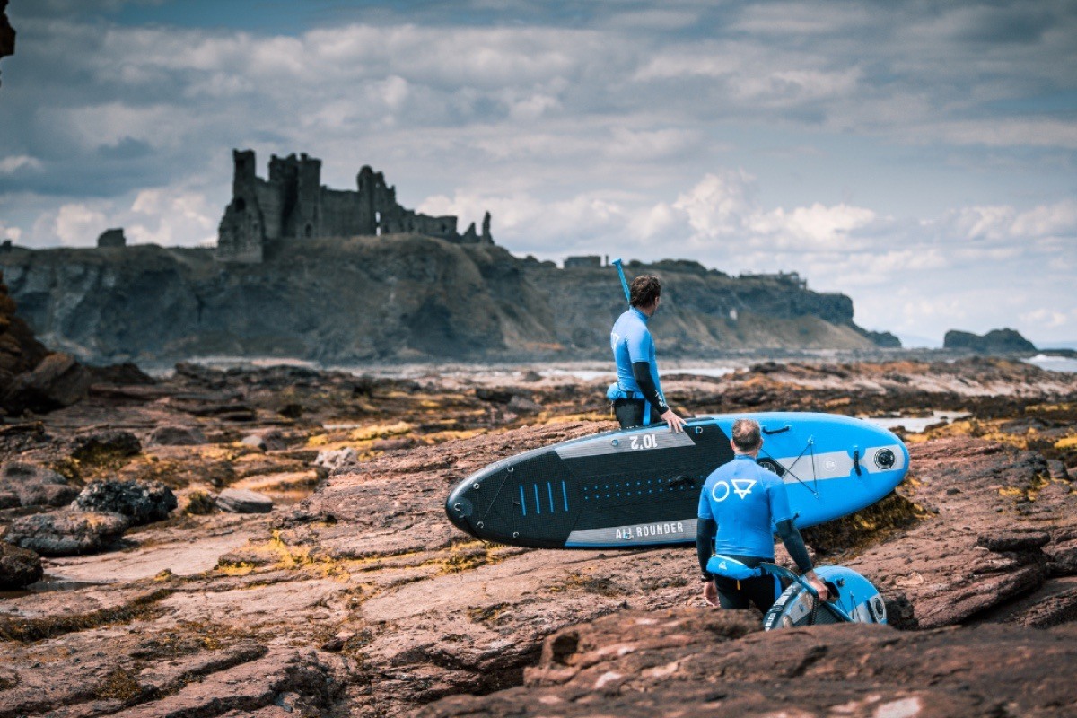 paddle boarding adventure by Tantallon Castle on Seacliff Beach in East Lothian Scotland