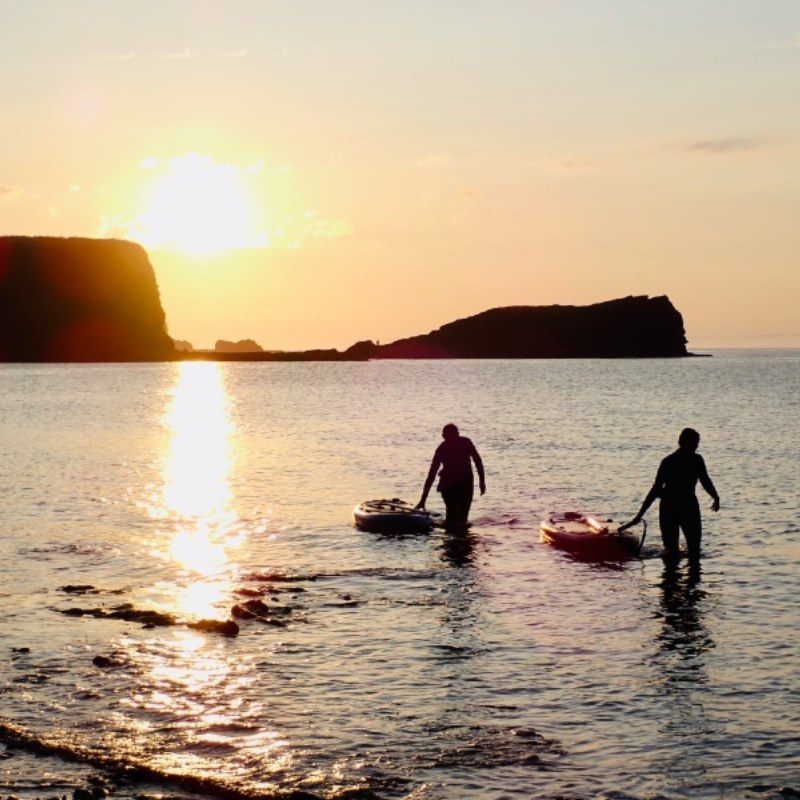 sunset paddle boarding SUP in East Lothian at Seacliff Beach by Dunbar and North Berwick