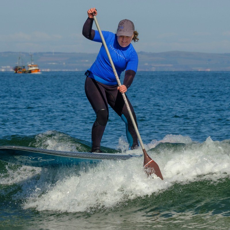 Mollie Hughes is SUP surfing at Seacliff Beach in East Lothian with Ocean vertical