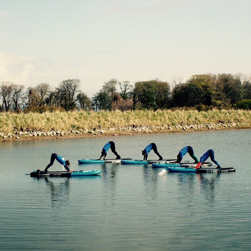 10 sup yoga downward dog position east lothian by the coast and seacliff beach for a new perspective and fun experience