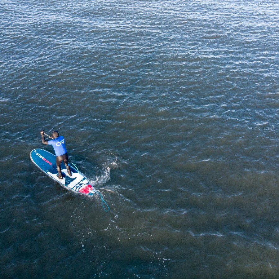 SUP paddle boarding aerial photograph at Belhaven Bay in East Lothian Scotland