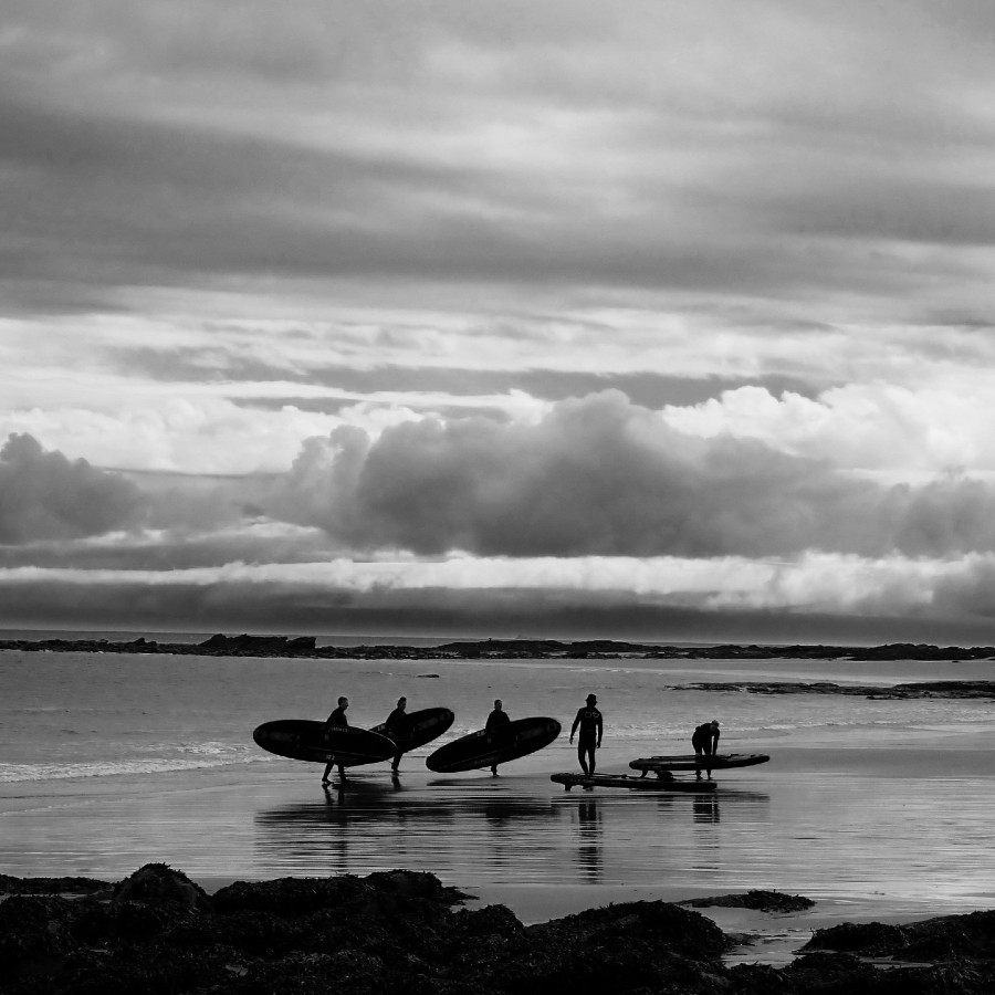 paddle boarding SUP with ocean vertical Academy of Surfing Instructors seacliff beach with a dark stormy sky east lothian