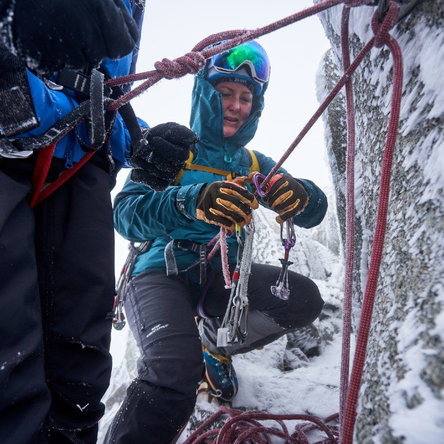 Mollie Hughes is winter climbing in Glen Coe Scotland. Photo by Hamish Frost