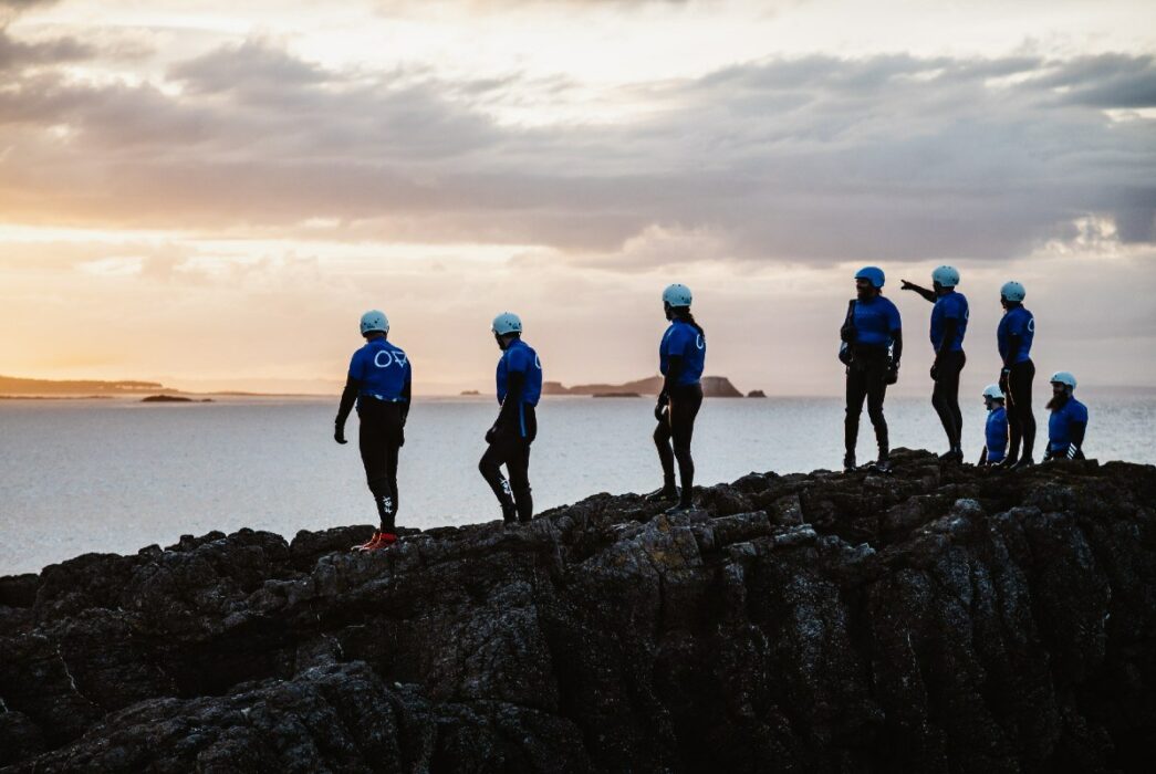 Ocean Vertical are coasteering with a corporate team at dusk in North Berwick East Lothian