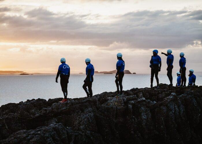 Ocean Vertical are coasteering with a corporate team at dusk in North Berwick East Lothian