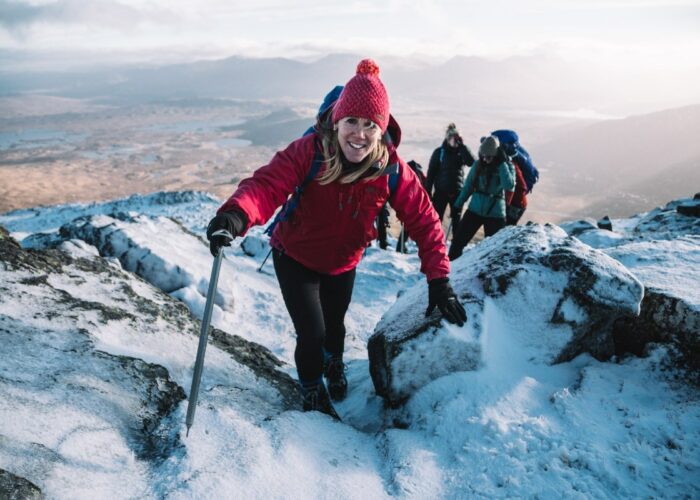 woman snow winter mountaineering skills climbing glen coe scotland
